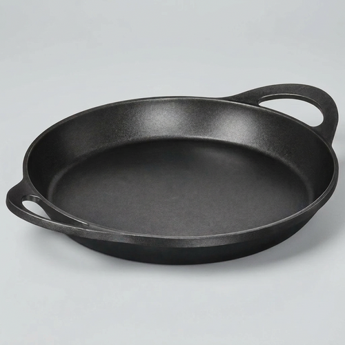 A black cast iron skillet with two side handles, photographed on a clean white background.